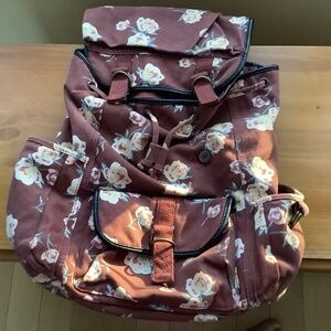 Canvas backpack with multiple pockets outside and inside, brown floral, lined
